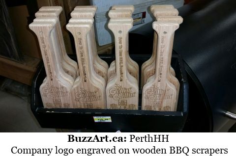 Company logo engraved on wooden BBQ scrapers